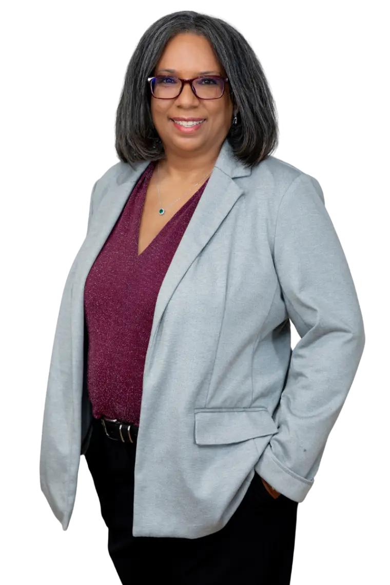 Tanya Poppleton - Professional woman in gray blazer smiling confidently